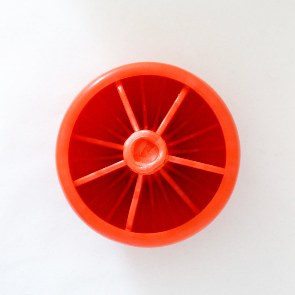 Milkcap Mushroom interactive dog toy in cherry tomato red