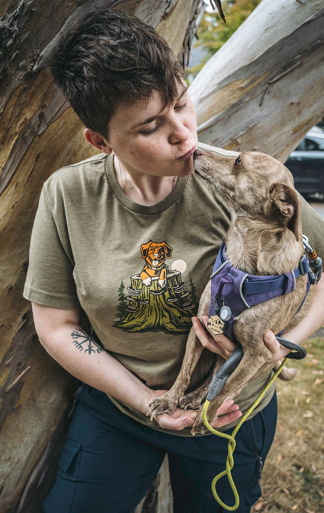 Woman holding her dog while wearing the Pup in a Stump shirt from Loblola.
